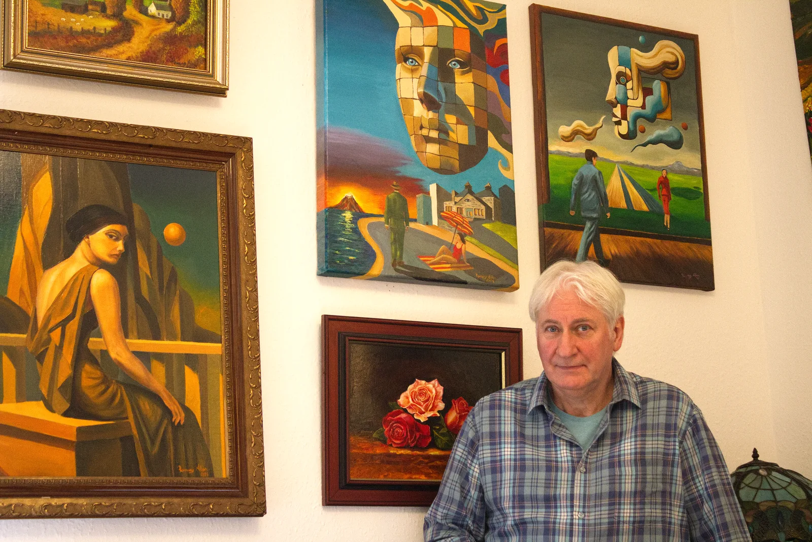Ramsay Allan in his studio, surrounded by his paintings